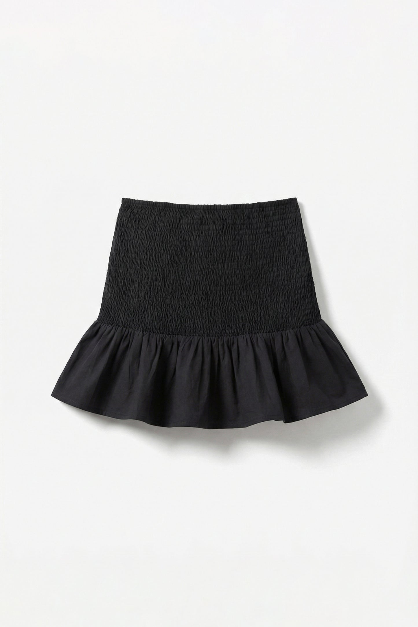 Black skirt with ruffled hem on a white background
