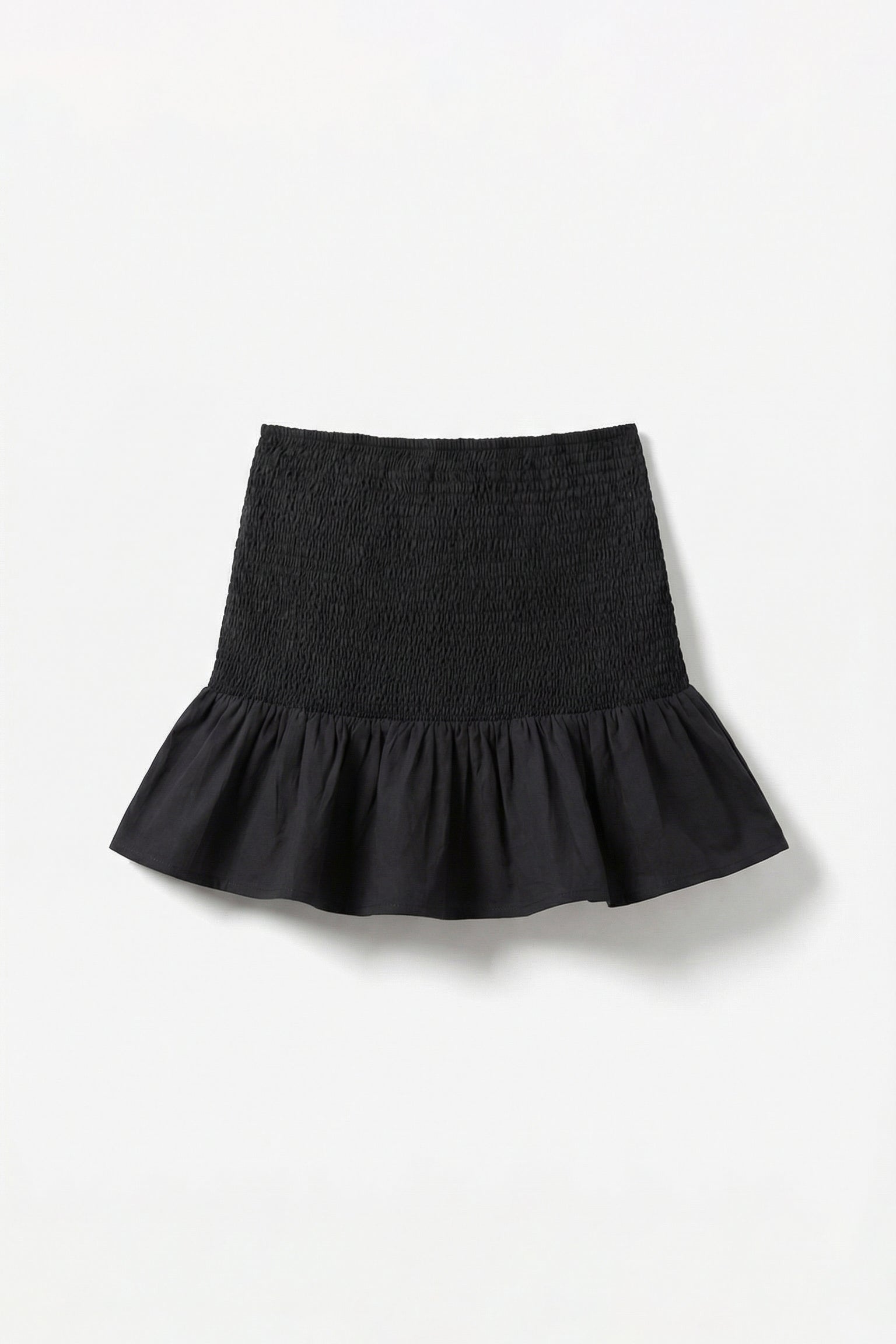 Black skirt with ruffled hem on a white background