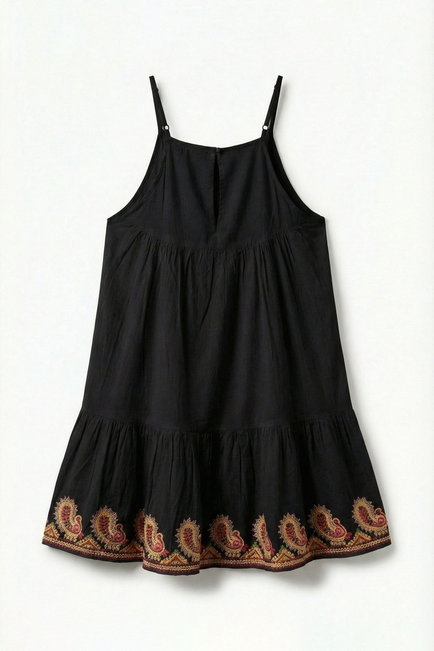 Black dress with embroidered details on a white background