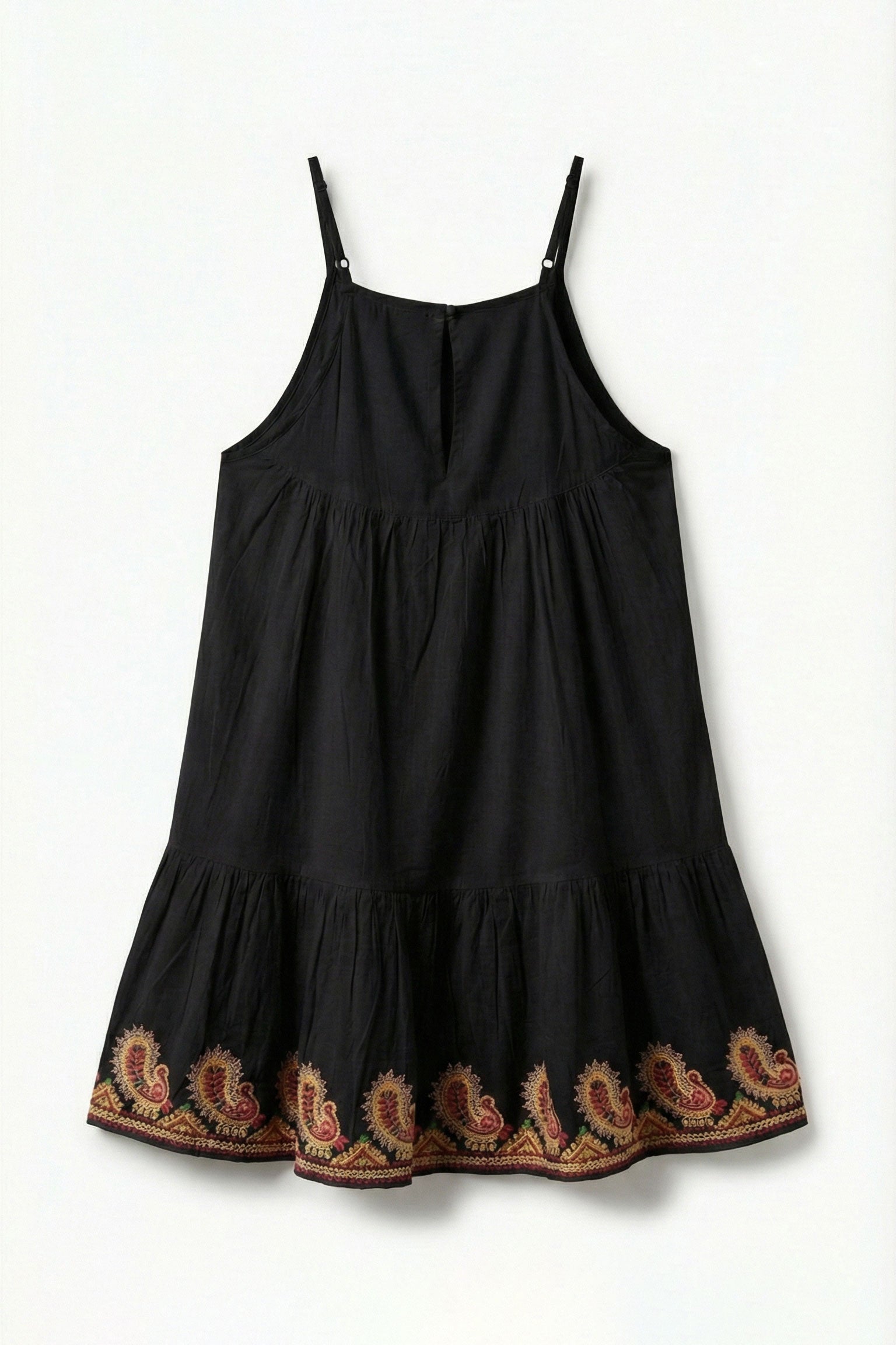 Black dress with embroidered details on a white background