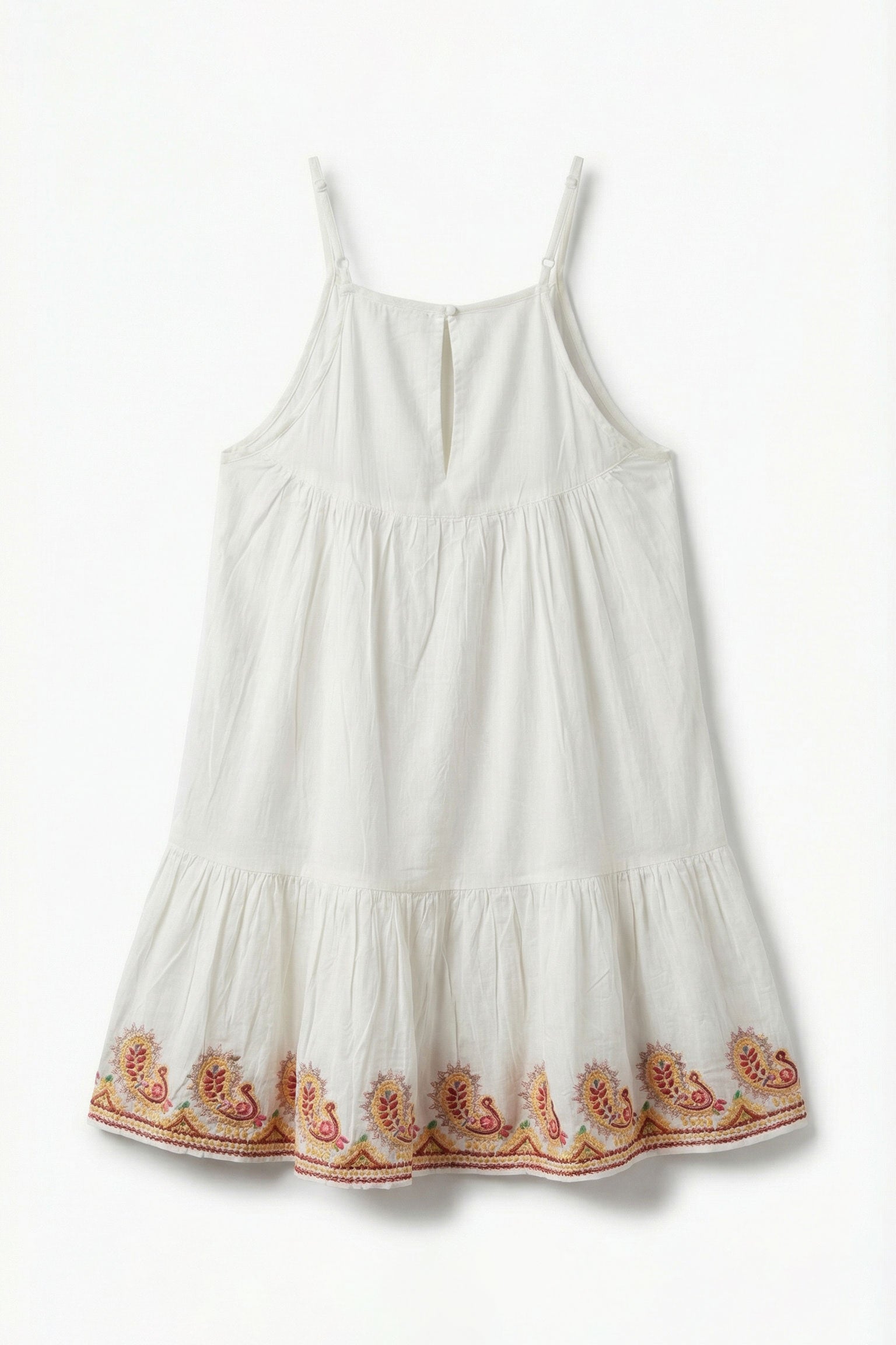 White dress with floral embroidery on a white background