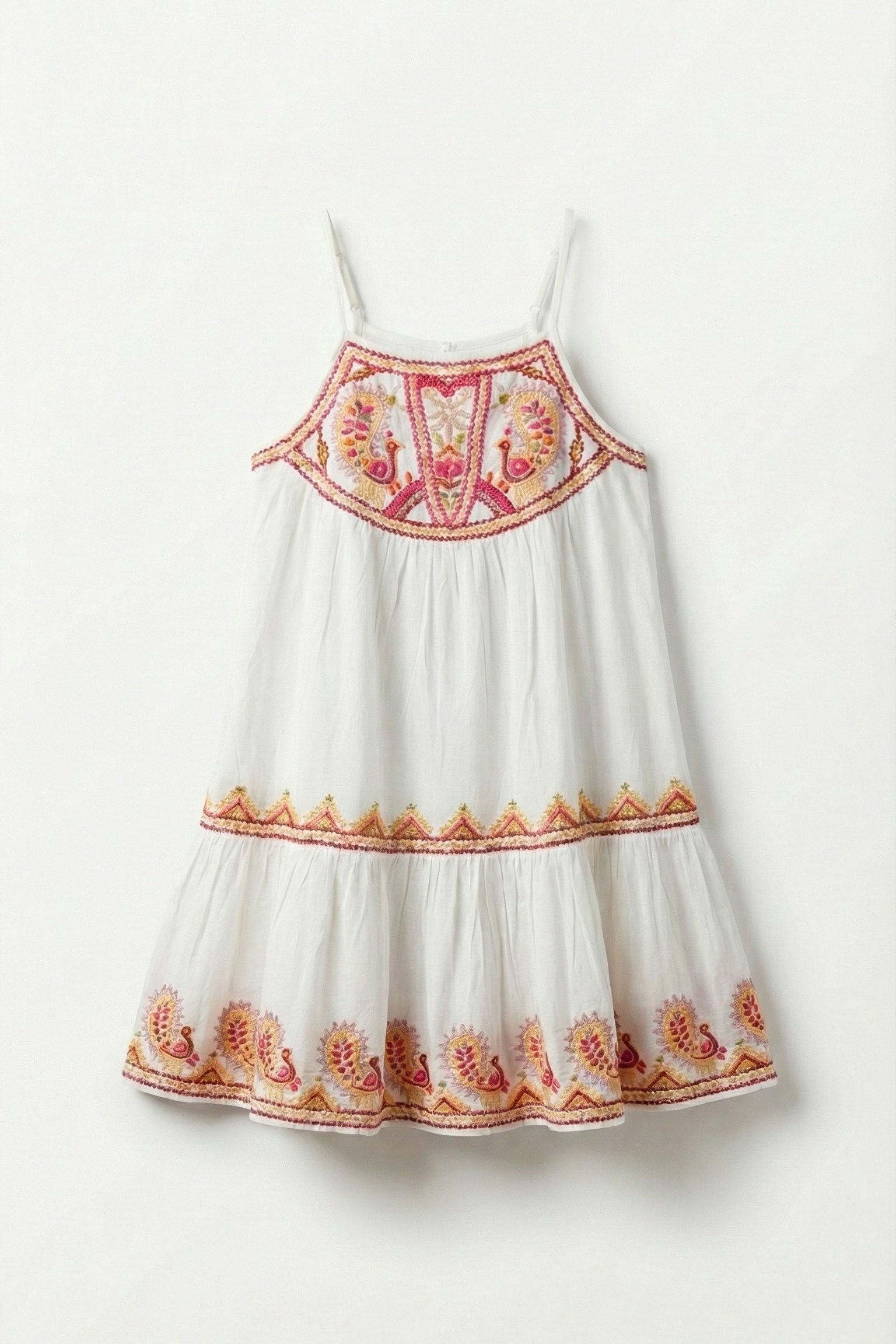 White dress with red and orange floral embroidery on a white background