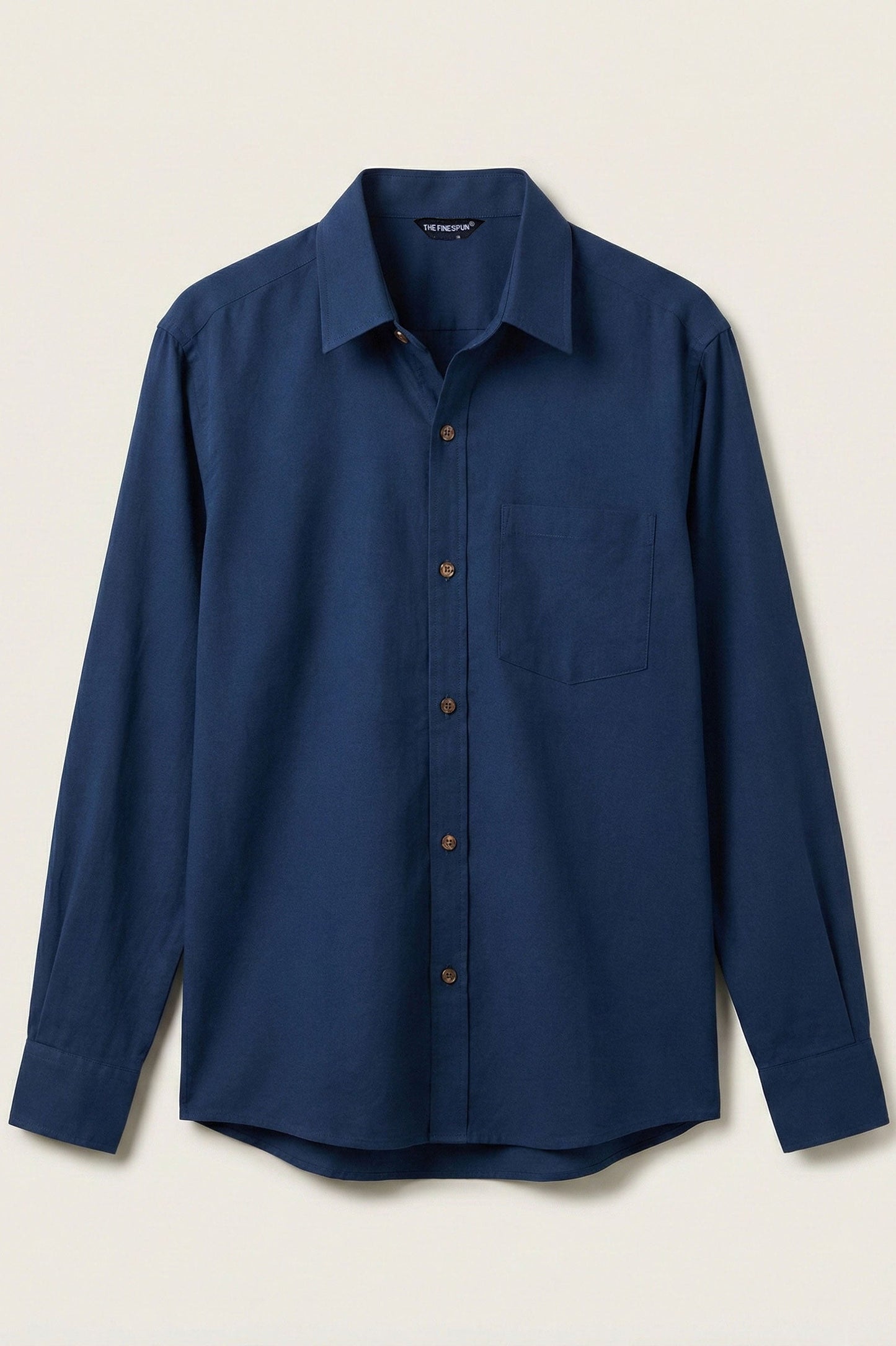 Blue shirt on a beige background