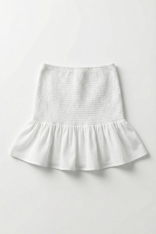 White skirt with smocked waistband on a white background