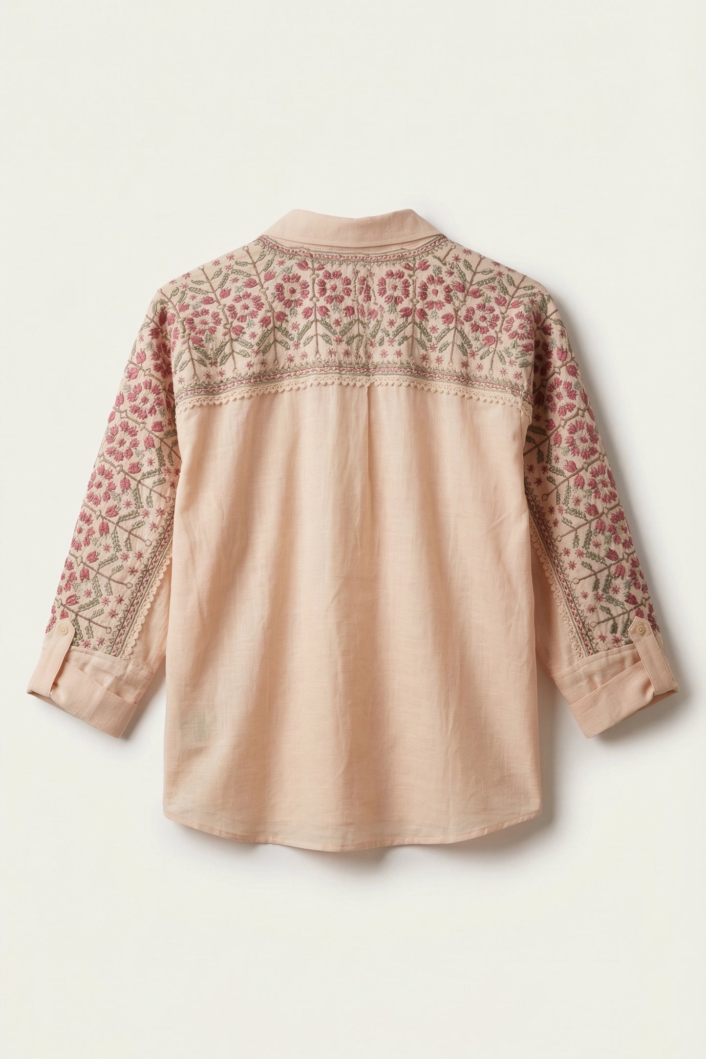 Beige blouse with floral embroidery on a white background