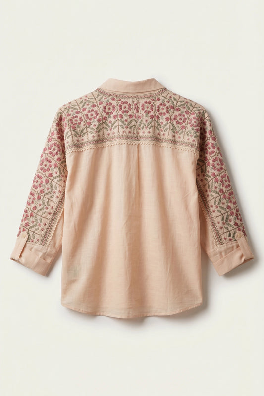 Beige blouse with floral embroidery on a white background
