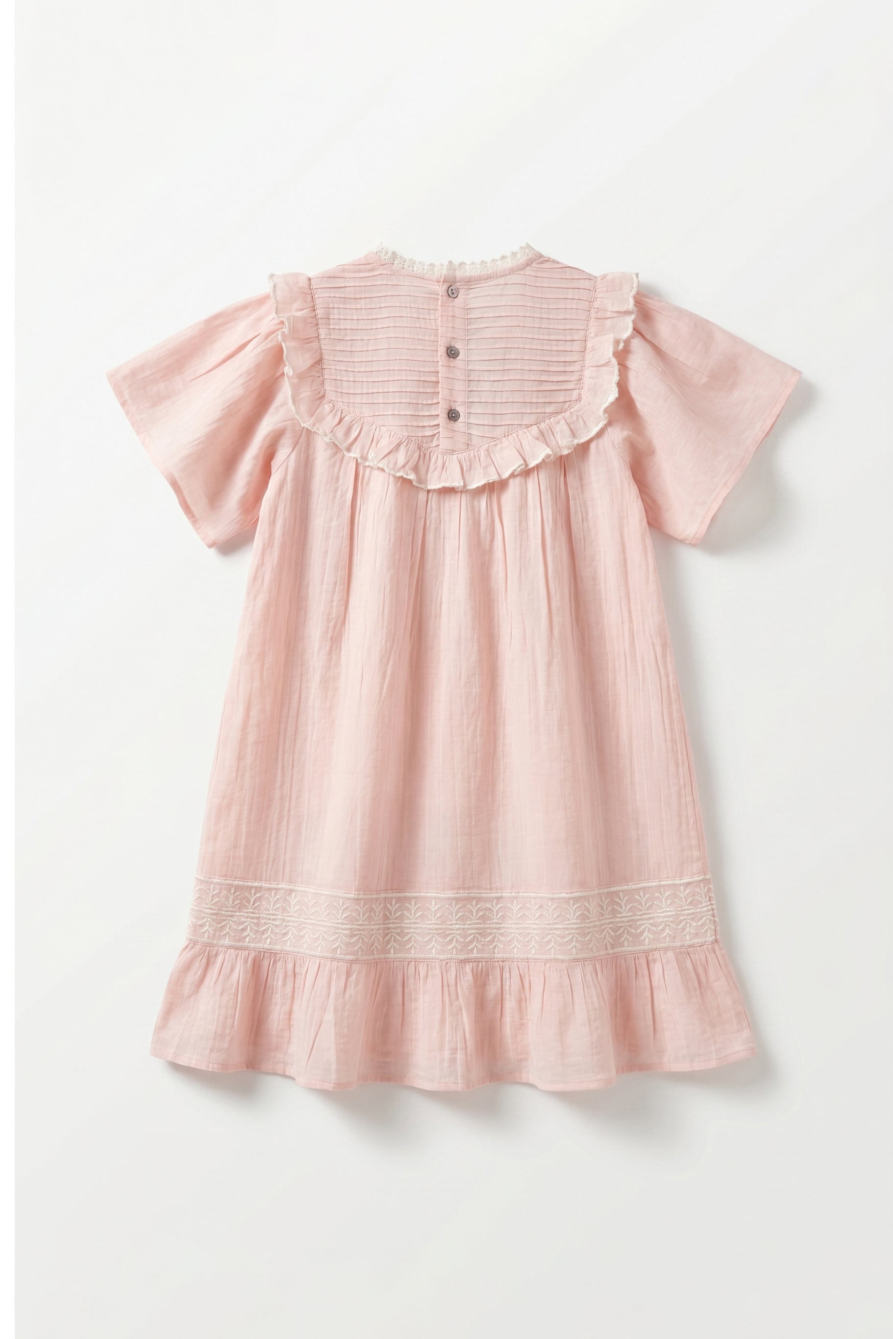 Pink dress with ruffled sleeves and hem on a white background
