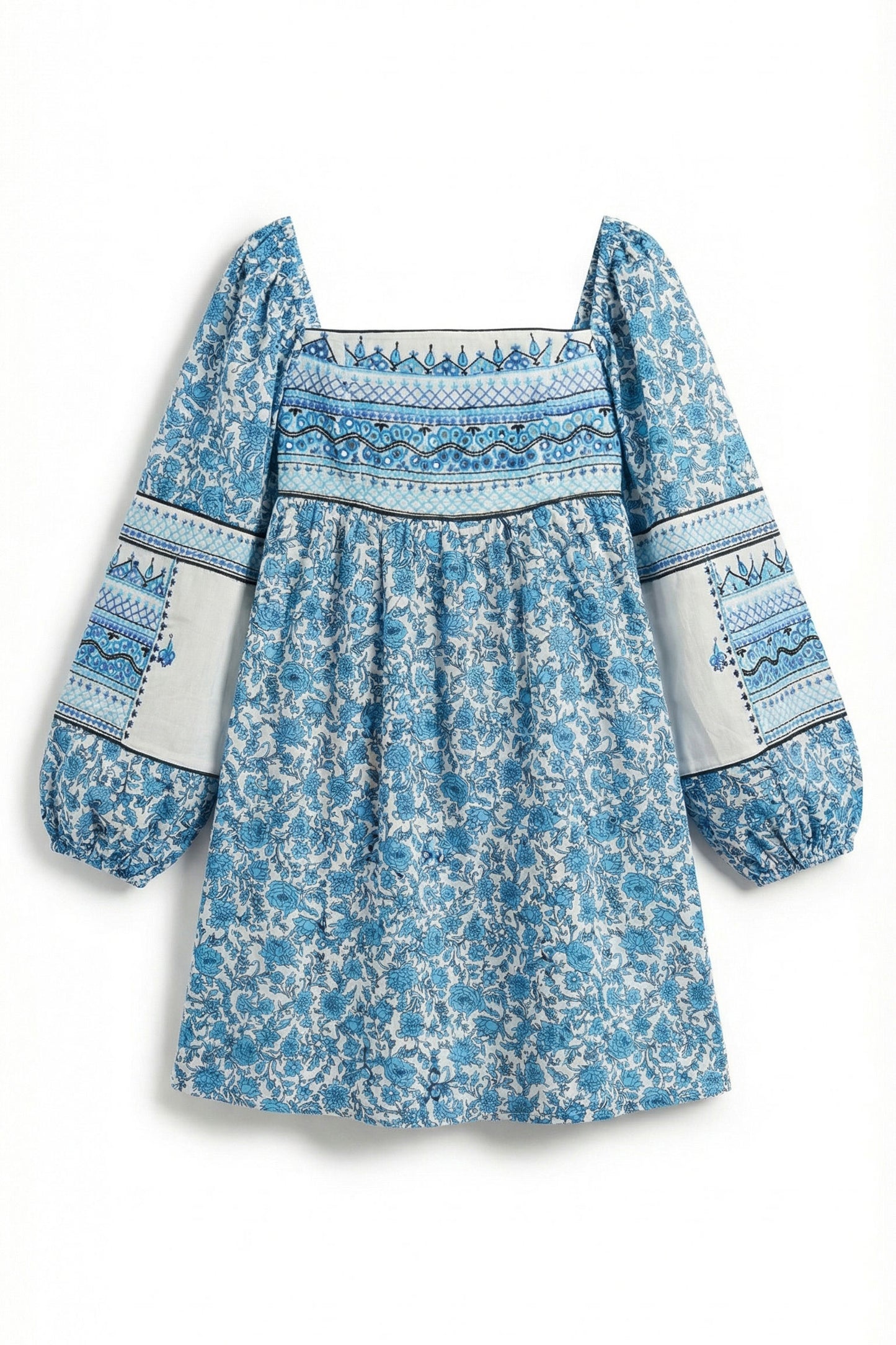 Blue floral dress with patterned trim on a white background