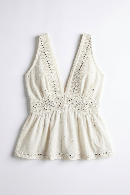 White lace-trimmed top on a light gray background