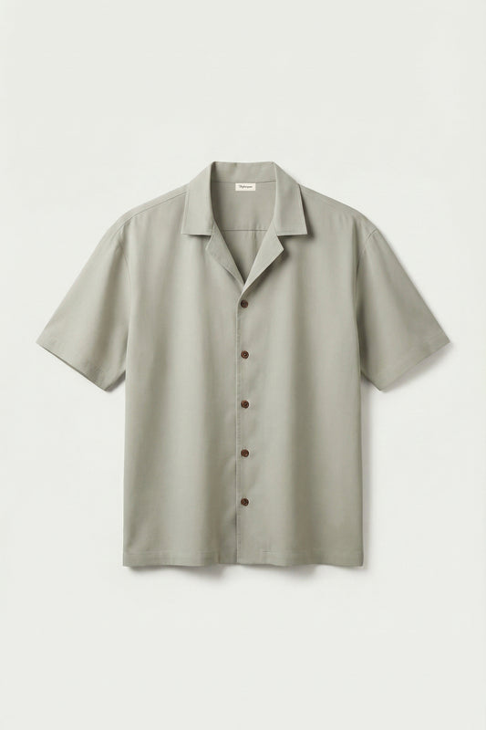 Light gray short-sleeve shirt on a light gray background