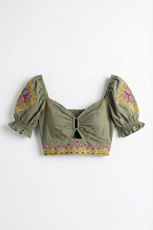 Green crop top with floral embroidery on a white background
