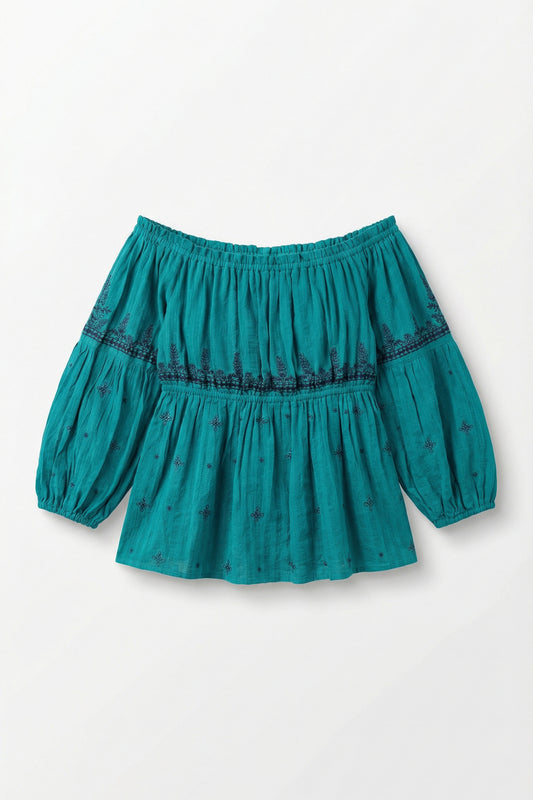 Teal blouse with puff sleeves on a white background