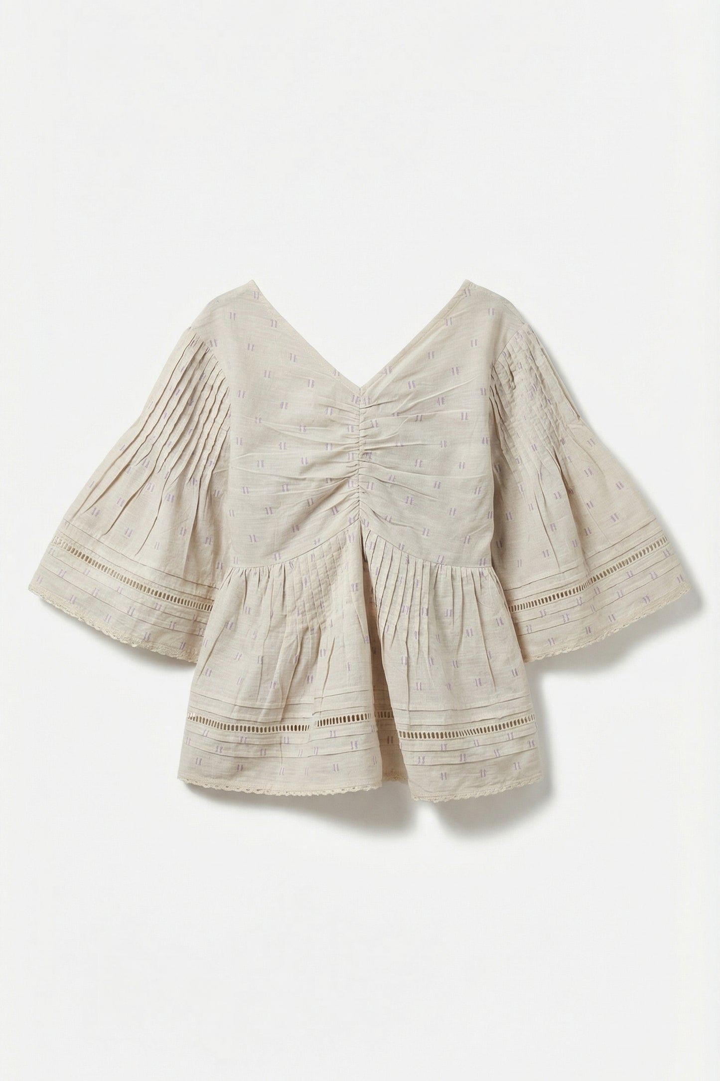 Beige blouse with ruched details on a white background