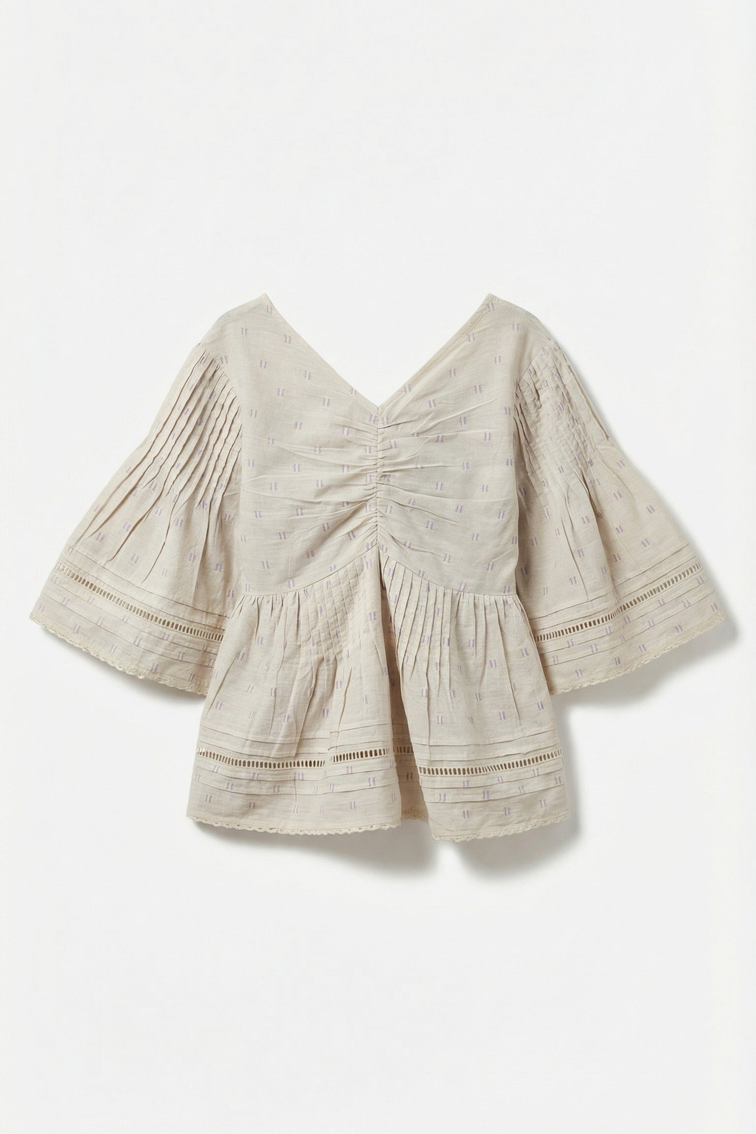 Beige blouse with ruched details on a white background