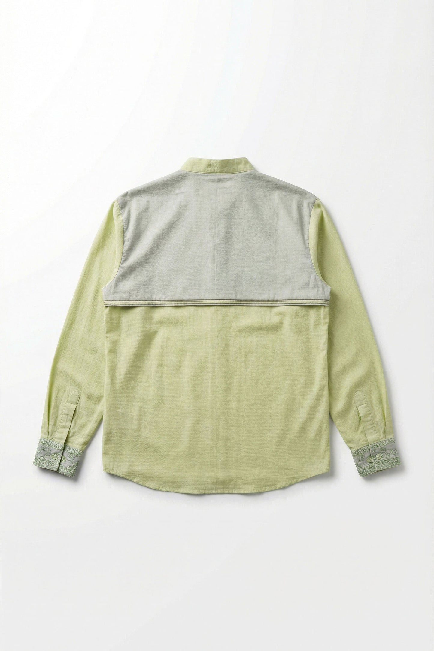 Light green shirt with gray accents on a white background
