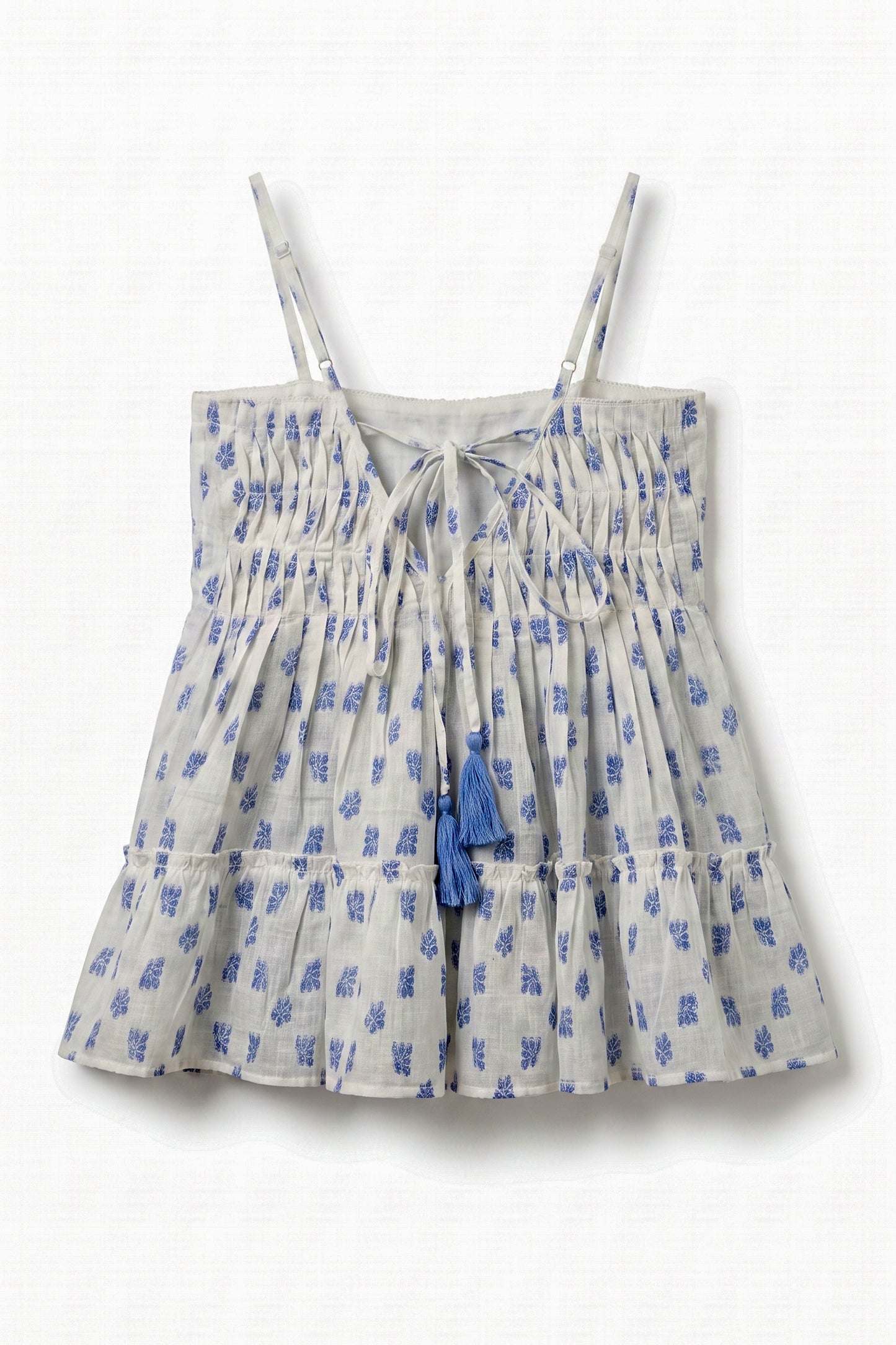 Back view of Vincent Pintuck Top for women showcasing adjustable tie-back with tassels, pintuck detailing, cotton dobby fabric, and tiered peplum design.
