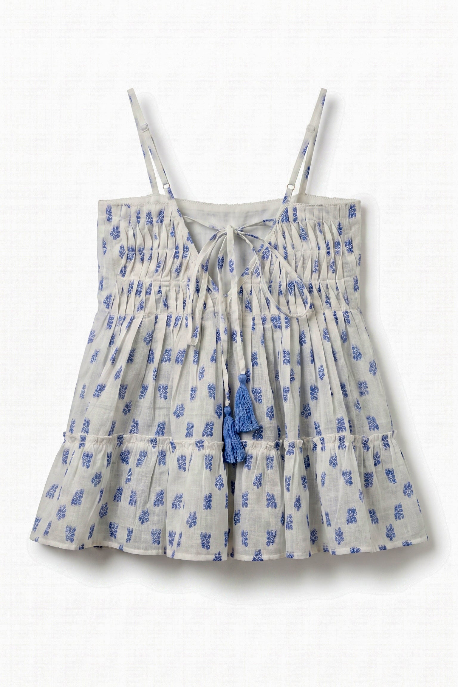 Back view of Vincent Pintuck Top for women showcasing adjustable tie-back with tassels, pintuck detailing, cotton dobby fabric, and tiered peplum design.