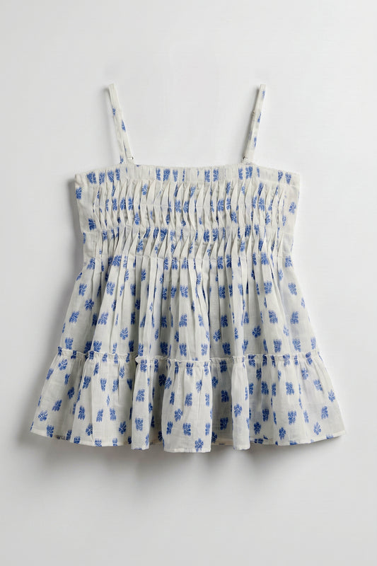 Vincent Pintuck Top for women in cotton dobby featuring handcrafted pintuck detailing, blue floral print, square neckline, and tiered peplum silhouette.