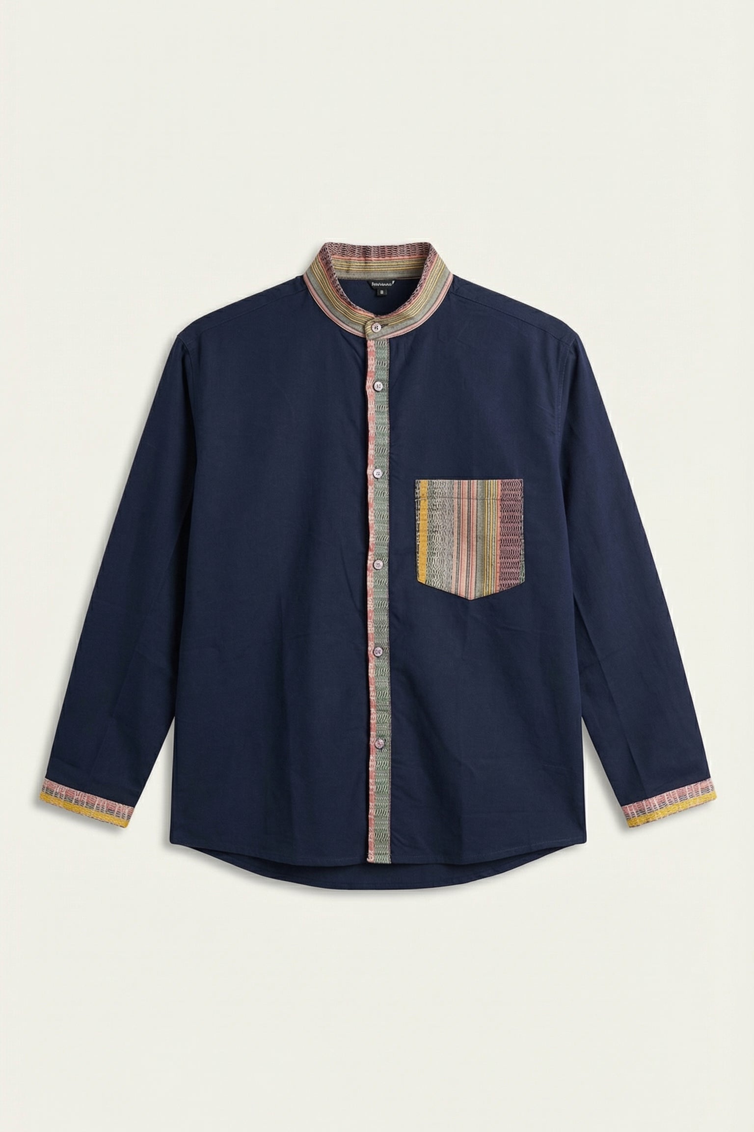 Navy blue shirt with patterned trim and pocket on a beige background