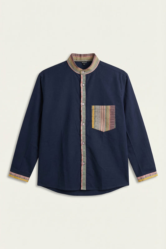 Navy blue shirt with patterned trim and pocket on a beige background