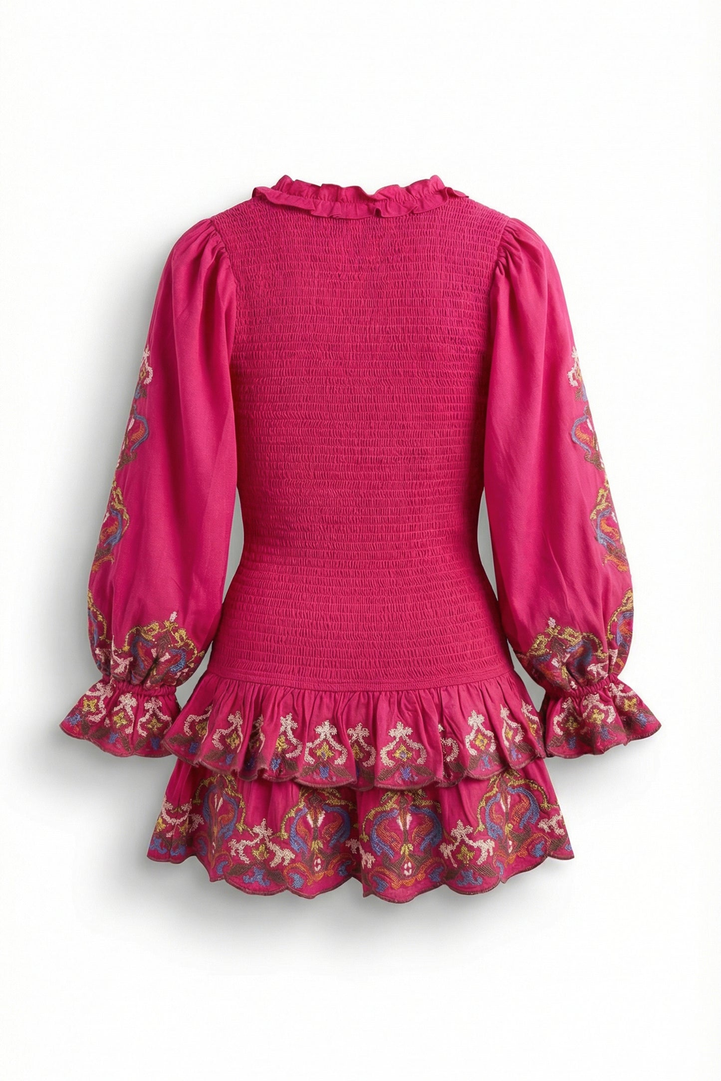 Pink dress with floral patterns on long sleeves and hem against a white background