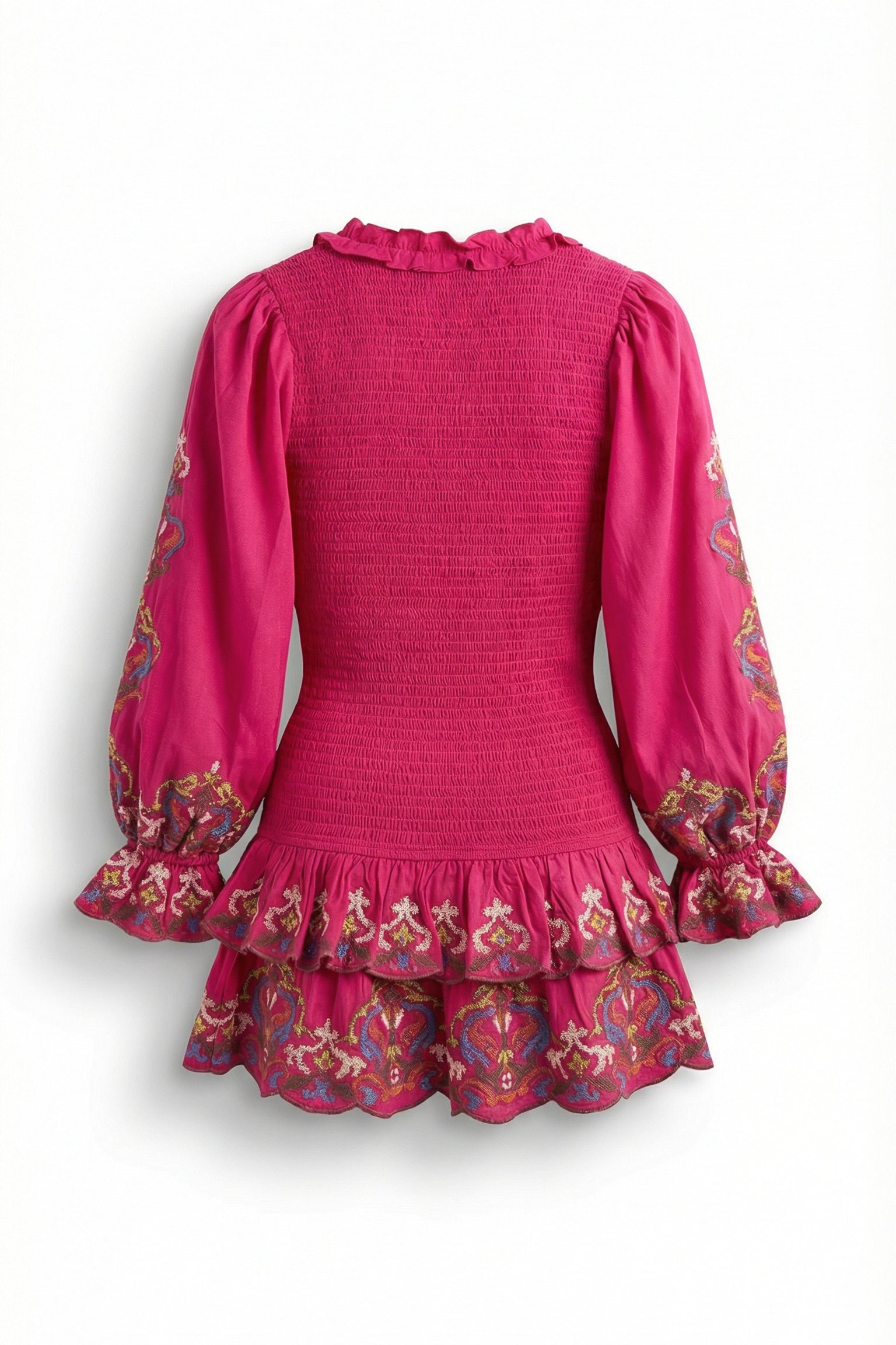 Pink dress with floral patterns on long sleeves and hem against a white background