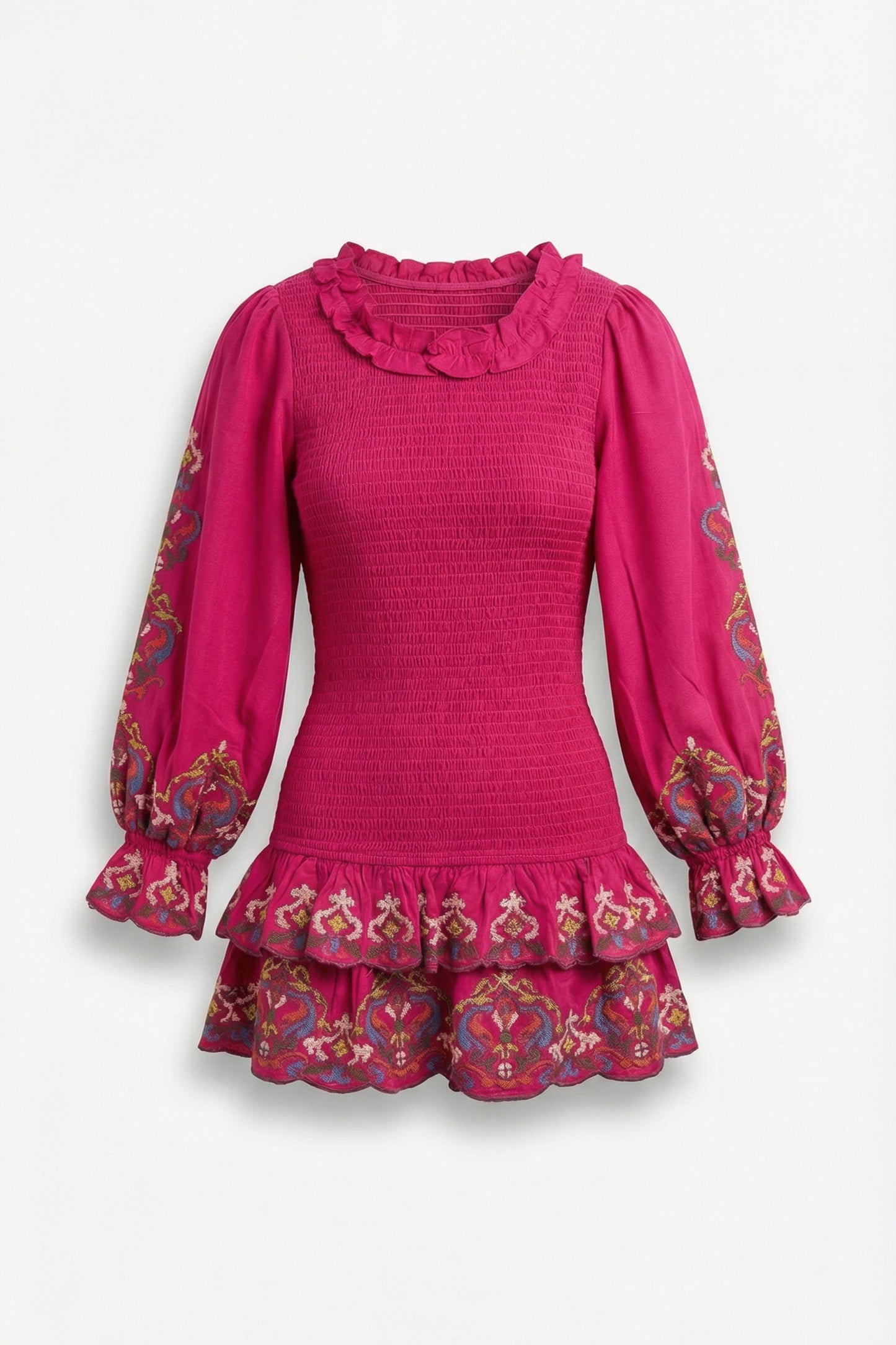 Pink dress with ruffled collar and cuffs on a white background