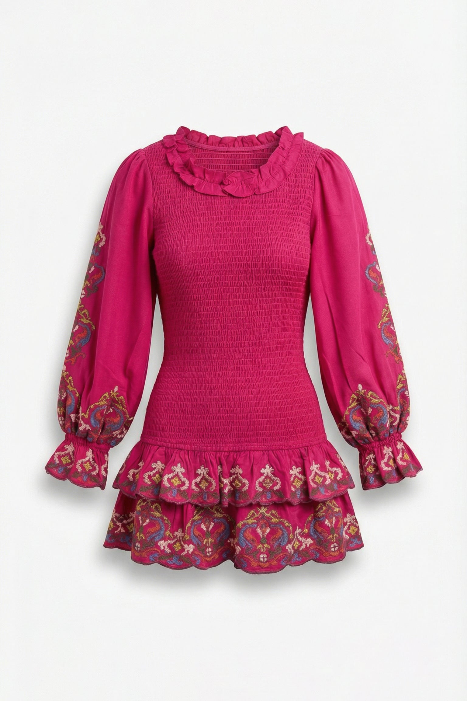 Pink dress with ruffled collar and cuffs on a white background