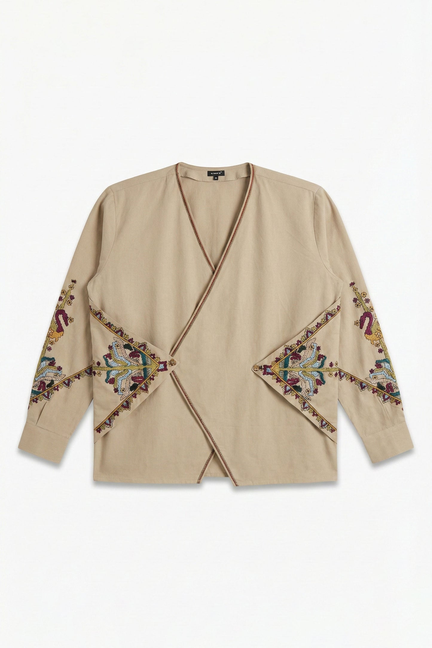Beige cardigan with colorful embroidery on a white background