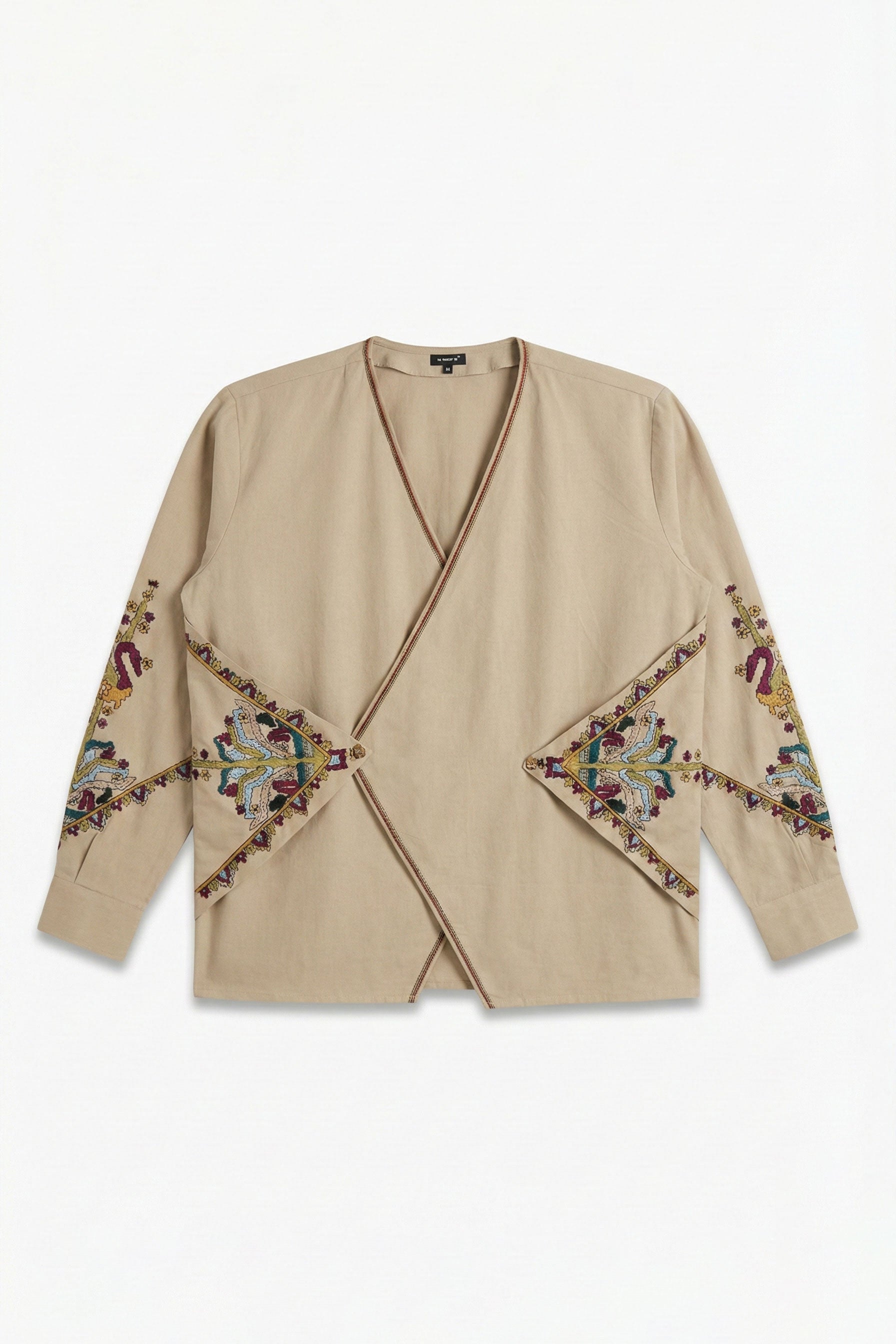 Beige cardigan with colorful embroidery on a white background