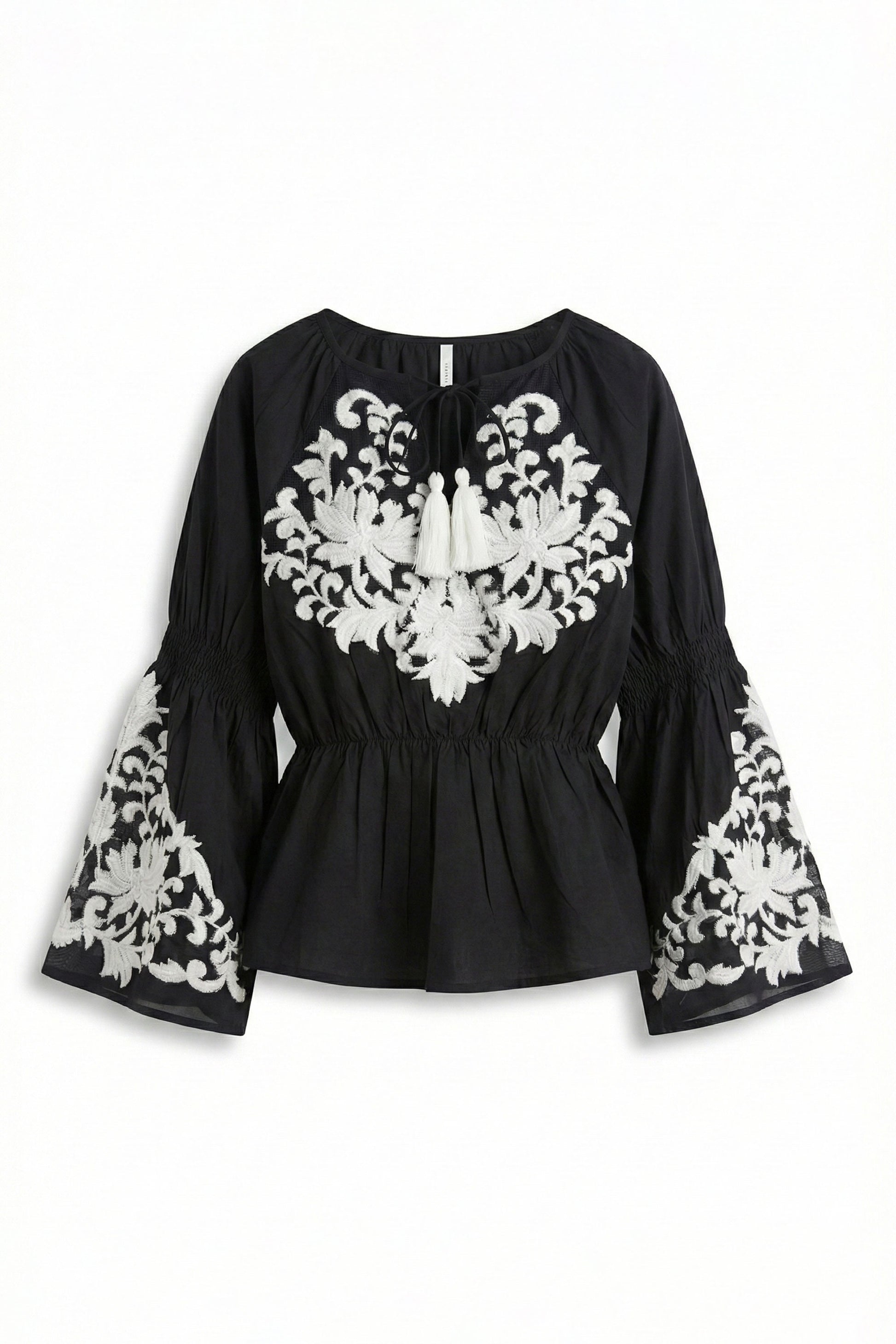 Black blouse with white floral embroidery on a white background