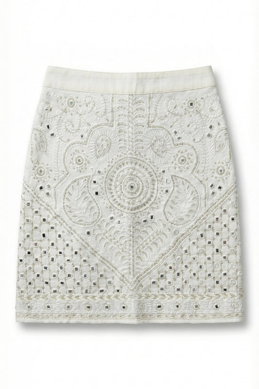 White lace skirt with intricate patterns on a white background