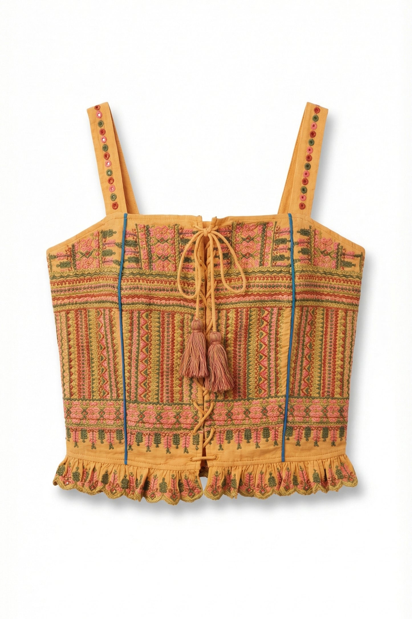Colorful patterned crop top with tassels on a white background