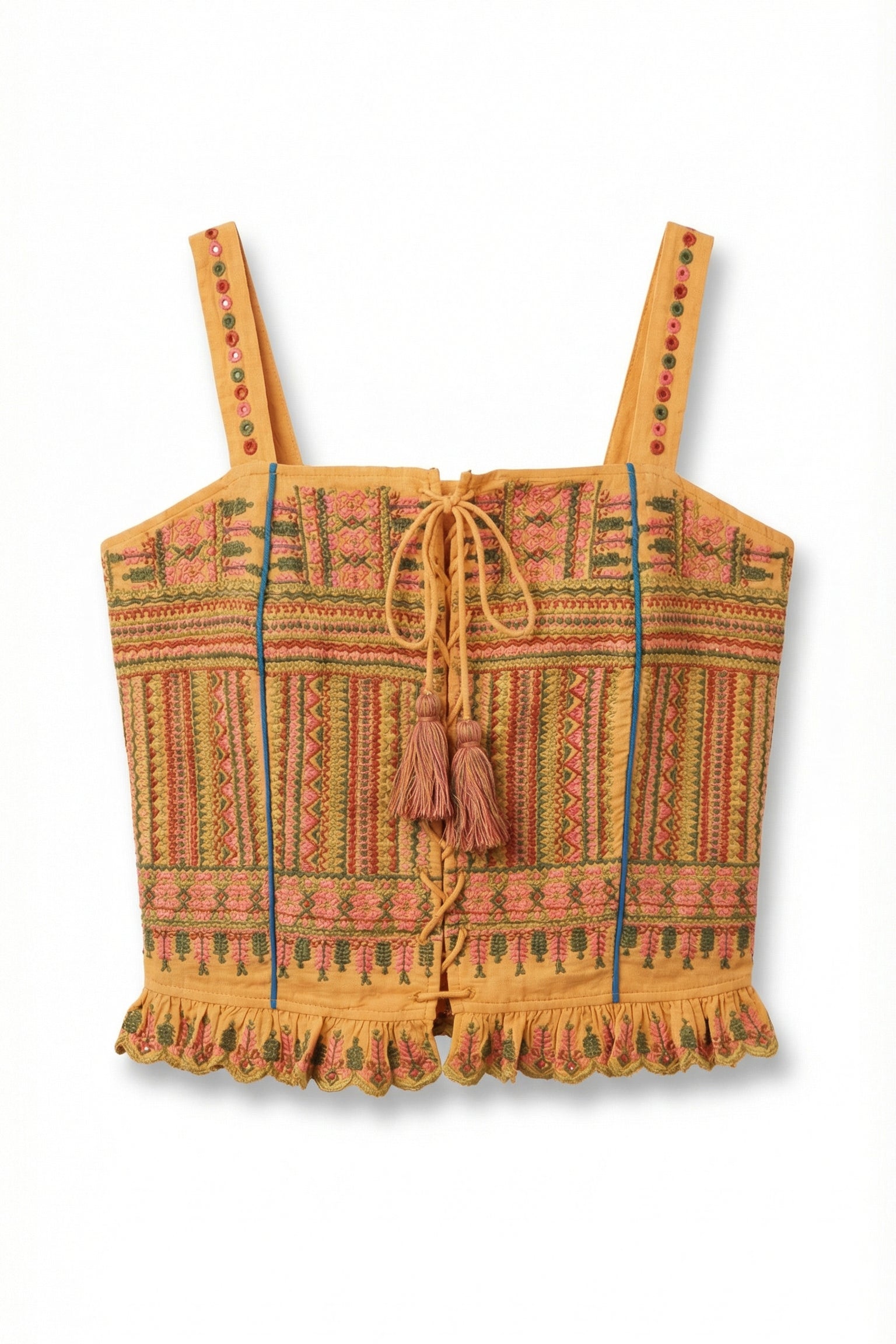 Colorful patterned crop top with tassels on a white background