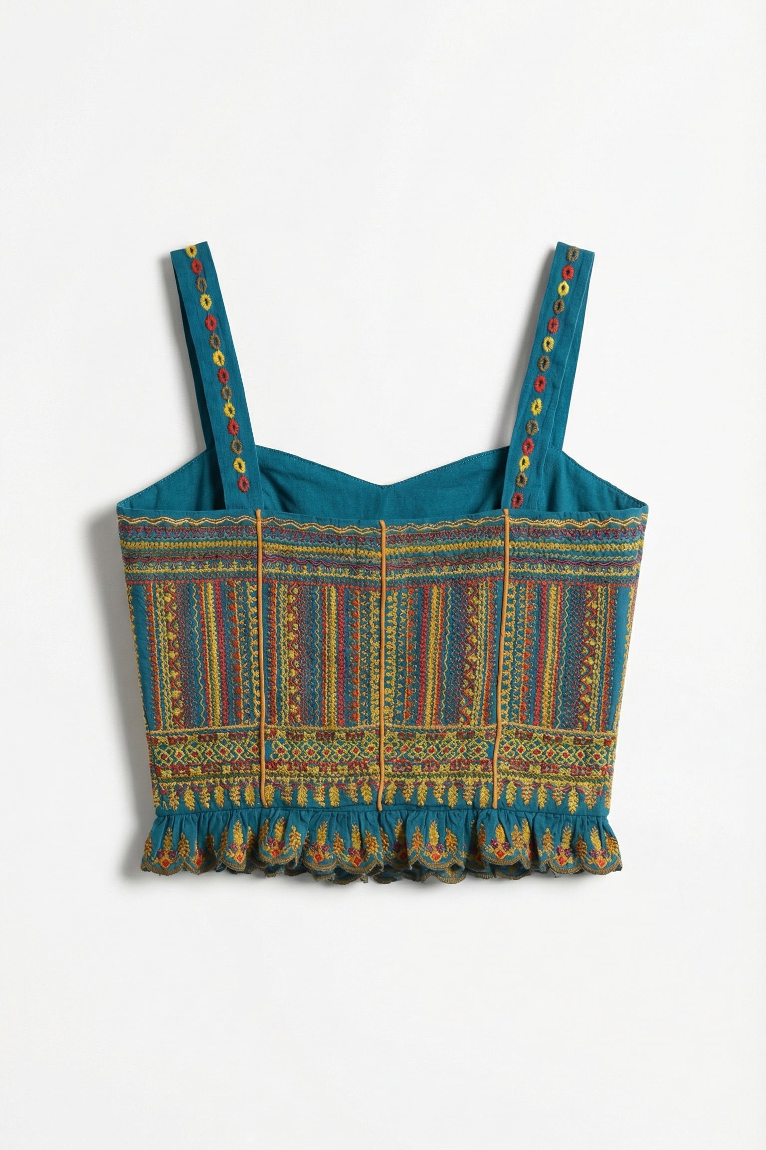 Blue patterned crop top with colorful straps on a white background